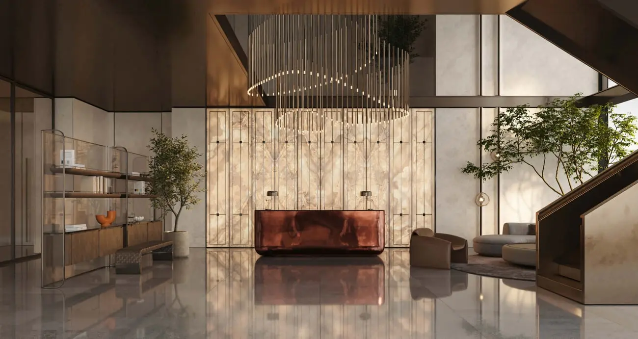 DWTN Residences double-height lobby with a reception desk, decorative lighting and large windows.